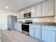 Kitchen featuring granite countertops, stainless appliances, and light wood cabinetry at 7782 Sail Clover Ln, Zephyrhills, FL 33540