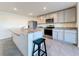 Kitchen featuring an island, granite countertops, and stainless steel appliances at 7782 Sail Clover Ln, Zephyrhills, FL 33540