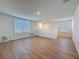 Large loft area with hardwood floors and windows allowing for plenty of natural light at 7782 Sail Clover Ln, Zephyrhills, FL 33540