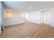 Bright loft area with modern wood-look flooring and neutral paint, perfect for flexible living space at 7782 Sail Clover Ln, Zephyrhills, FL 33540