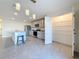 Kitchen features a large pantry, granite countertops, stainless appliances, and an island at 7782 Sail Clover Ln, Zephyrhills, FL 33540