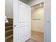 Bright storage space with hardwood floors and wall mounted coat hooks for added organization at 7782 Sail Clover Ln, Zephyrhills, FL 33540