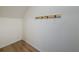 Interior storage space with hardwood floors and wall mounted coat hooks for added organization at 7782 Sail Clover Ln, Zephyrhills, FL 33540