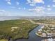 A stunning aerial view of the community featuring homes located on canals leading to the ocean at 813 Manns Harbor Dr, Apollo Beach, FL 33572