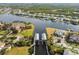 Aerial view of waterfront homes with docks and boat lifts, showcasing the neighborhood at 813 Manns Harbor Dr, Apollo Beach, FL 33572