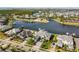 Aerial view of waterfront homes with docks, lifts, and canals in the neighborhood at 813 Manns Harbor Dr, Apollo Beach, FL 33572