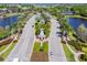 Aerial view of community entrance with lush landscaping and elegant architecture at 813 Manns Harbor Dr, Apollo Beach, FL 33572