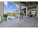 Stunning outdoor living space featuring a pool with water features, covered patio, and beautiful landscaping for relaxation and enjoyment at 813 Manns Harbor Dr, Apollo Beach, FL 33572