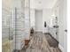 Bathroom showcasing the walk-in shower with decorative tile and dual vanities at 813 Manns Harbor Dr, Apollo Beach, FL 33572