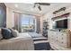 Bedroom featuring modern furnishings, TV, and outdoor views from large window at 813 Manns Harbor Dr, Apollo Beach, FL 33572