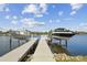 Private boat dock featuring boat lifts with a water view at 813 Manns Harbor Dr, Apollo Beach, FL 33572