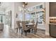 Dining room featuring wood floors and a wine rack with a view of the water at 813 Manns Harbor Dr, Apollo Beach, FL 33572