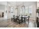Elegant dining room with decorative hanging lights and large windows providing ample natural light at 813 Manns Harbor Dr, Apollo Beach, FL 33572