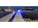 Dock at night with blue LED lighting illuminating boat lifts at 813 Manns Harbor Dr, Apollo Beach, FL 33572