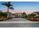 Beautiful home featuring professional landscaping, a brick driveway and a grand facade at 813 Manns Harbor Dr, Apollo Beach, FL 33572