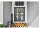 Close up of front door featuring wreath, matching door mat and a welcome sign at 813 Manns Harbor Dr, Apollo Beach, FL 33572