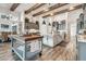 Bright kitchen with wooden beams, pendant lighting, and a central island with marble countertops at 813 Manns Harbor Dr, Apollo Beach, FL 33572