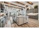 Spacious kitchen with a large center island, pendant lights and stainless steel appliances at 813 Manns Harbor Dr, Apollo Beach, FL 33572