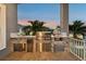 View of an outdoor kitchen featuring stone block finish, stainless steel, and an island backdrop at 813 Manns Harbor Dr, Apollo Beach, FL 33572