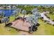 Community playground with shade and swings surrounded by mature palm trees at 813 Manns Harbor Dr, Apollo Beach, FL 33572