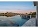 Stunning pool with infinity edge and fire feature overlooking the tranquil waterfront at 813 Manns Harbor Dr, Apollo Beach, FL 33572