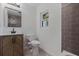 Updated bathroom with modern vanity, tiled shower, and decorative window at 8401 Stillbrook Ave, Tampa, FL 33615