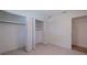 Bright bedroom with tile floors, closet, and doorway leading to another room at 8401 Stillbrook Ave, Tampa, FL 33615