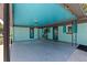 Spacious carport offering covered parking and a stylish turquoise ceiling at 8401 Stillbrook Ave, Tampa, FL 33615