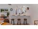 Bright kitchen with quartz breakfast bar, stainless appliances, and pendant lighting at 8401 Stillbrook Ave, Tampa, FL 33615