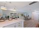 Bright, open concept featuring stainless appliances and direct views of the backyard pool at 8401 Stillbrook Ave, Tampa, FL 33615