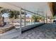 Enclosed pool area with tile flooring, ceiling fans, and clear views to the pool at 8401 Stillbrook Ave, Tampa, FL 33615