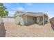 This backyard features a brick patio, and covered sitting area, and a privacy fence perfect for relaxing or entertaining at 9112 Suffield Ct, Tampa, FL 33615
