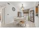 Cozy dining area with tile floors, a round table, and a charming chandelier, perfect for Gathering meals at 9112 Suffield Ct, Tampa, FL 33615