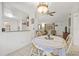Bright dining room with tile floors and an open layout to the living area, ideal for entertaining guests at 9112 Suffield Ct, Tampa, FL 33615
