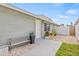Inviting home exterior featuring a cozy bench and well-maintained patio, perfect for enjoying the outdoors at 9112 Suffield Ct, Tampa, FL 33615