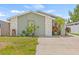 Charming single-story home with a well-maintained lawn and beautiful stone accents at 9112 Suffield Ct, Tampa, FL 33615
