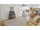 Inviting living room with tile flooring, seamlessly connects to the kitchen and dining area at 9112 Suffield Ct, Tampa, FL 33615