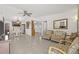 Bright living room featuring tile floors that flow into dining and kitchen area, perfect for entertaining at 9112 Suffield Ct, Tampa, FL 33615