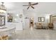 Open living room showing connection between kitchen, dining and living area on a neutral tile floor at 9112 Suffield Ct, Tampa, FL 33615