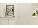 Clean hallway with white walls, a decorative mirror, and modern accents at 9616 Runaway Breeze Dr, Land O Lakes, FL 34637