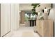 Welcoming living room with sleek console table and modern lighting, offering a comfortable and stylish living space at 9652 Runaway Breeze Dr, Land O Lakes, FL 34637