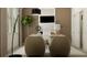 Home office with neutral decor, comfortable seating, and abundant natural light at 9652 Runaway Breeze Dr, Land O Lakes, FL 34637
