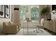 Bright home office area featuring neutral decor, a large window, and comfortable seating at 9652 Runaway Breeze Dr, Land O Lakes, FL 34637