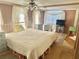 Comfortable bedroom with a queen-sized bed, soft lighting, and ample natural light at 9790 66Th N St # 80, Pinellas Park, FL 33782
