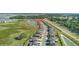 Aerial view displays a suburban neighborhood next to a lake and close to other residential areas at 9893 Branching Ship Trce, Wesley Chapel, FL 33545