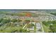 An aerial view pinpoints the property in a neighborhood with ponds at 9893 Branching Ship Trce, Wesley Chapel, FL 33545