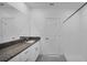 Bathroom featuring a large mirror, vanity with granite countertops, and a stand up shower at 9893 Branching Ship Trce, Wesley Chapel, FL 33545