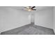 Comfortable bedroom featuring neutral carpet, a ceiling fan, and large closet at 9893 Branching Ship Trce, Wesley Chapel, FL 33545