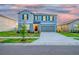 Beautiful two-story home with a two-car garage and well-manicured landscaping at 9893 Branching Ship Trce, Wesley Chapel, FL 33545