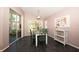 Charming dining room with natural light, modern light fixture and sliding glass door at 10321 Ravines Dr, New Port Richey, FL 34654